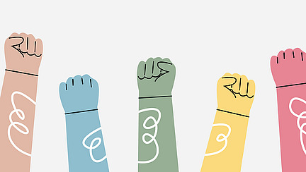 Multiple colorful fists are raised into the air