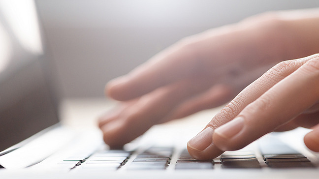 Typing hands on keyboard