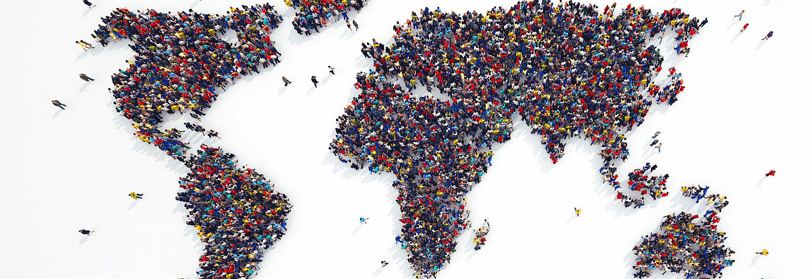 People standing together form a world map against a white background.