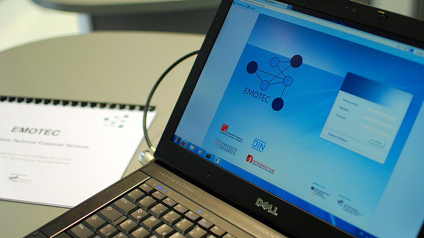 Close-up of an unlocked laptop on which the login screen for a program is displayed.