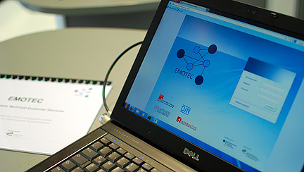 Close-up of an unlocked laptop on which the login screen for a program is displayed.